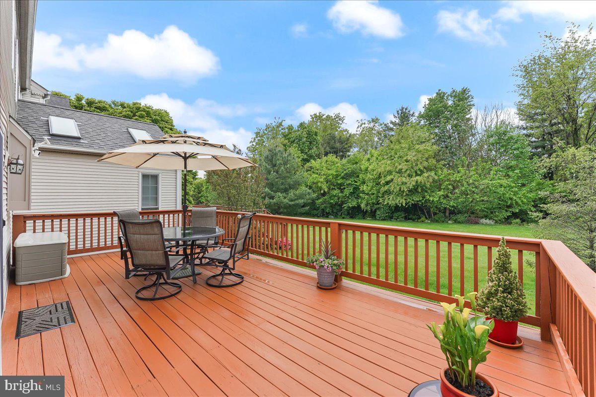 107 Cambridge Circle, Unit 50 Kennett Square, PA 19348 - Photo 33 of 36 Large deck with tree-lined common area views