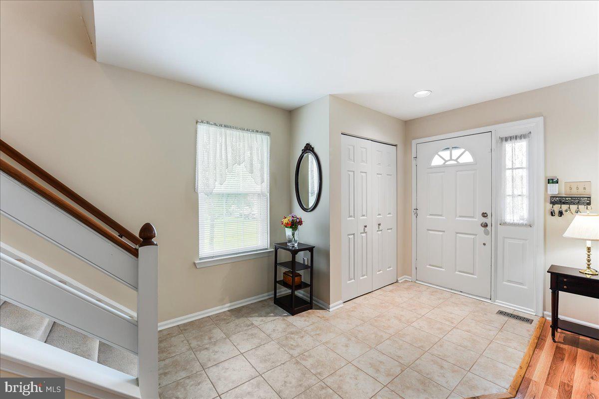 107 Cambridge Circle, Unit 50 Kennett Square, PA 19348 - Photo 4 of 36 Large sunny foyer with coat closet