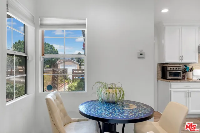a view of a dining room with furniture window and outside view