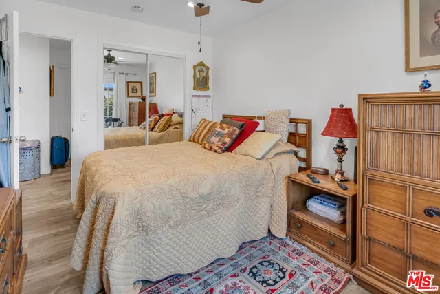a bedroom with a bed and a cabinets