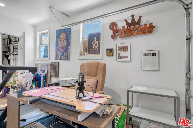 a view of a workspace with furniture and toys