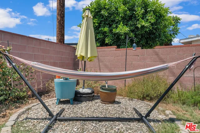 a view of a chair and table in the balcony