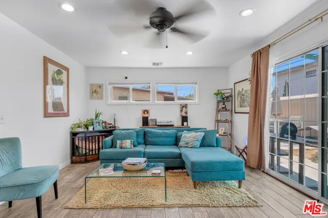 a living room with furniture and a rug