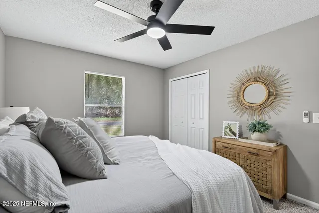 a bedroom with a bed and window