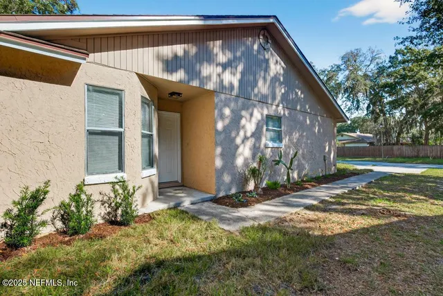 a view of backyard with a small cabin