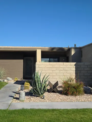 a view of a swimming pool with a chair