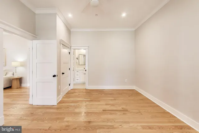 a bathroom with a double vanity sink toilet mirror and shower
