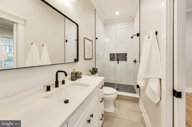 a bedroom with a large bed and a large window