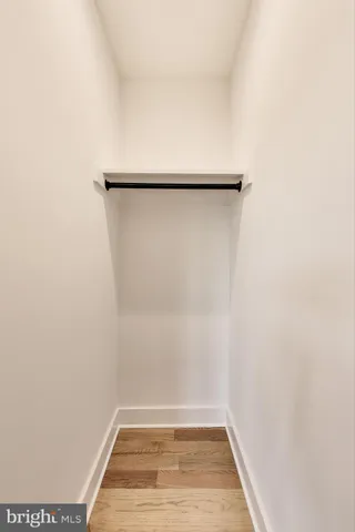 a white bath tub sitting in a bathroom next to a window