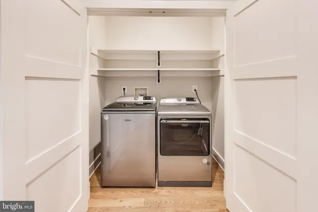 a view of a livingroom with furniture and wooden floor