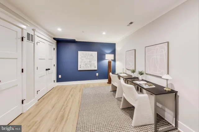 a living room with furniture window and wooden floor
