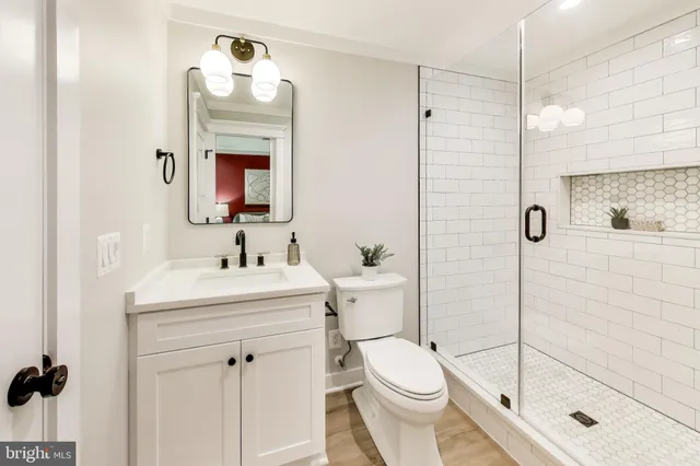 a front view of a house with a garden and plants