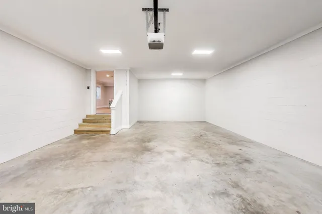 a living room with furniture pool table and flat screen tv