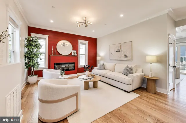a living room with furniture a window and a fireplace