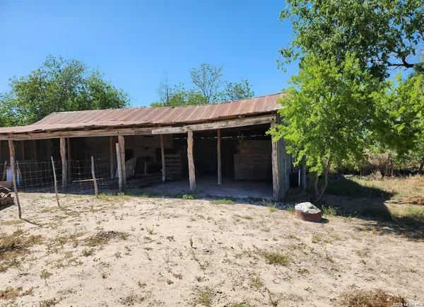 a house with trees in the background