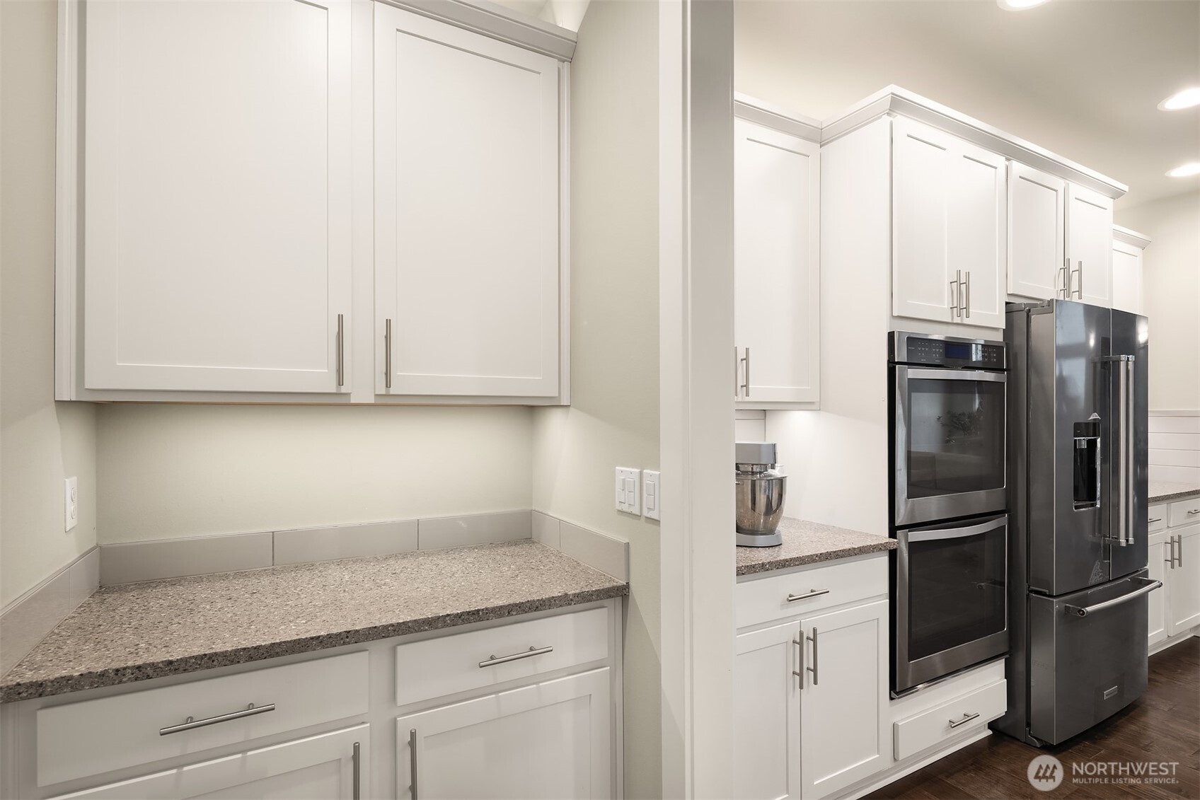 1435 242nd Place Southeast Bothell, WA 98021 - Photo 19 of 40 a kitchen with stainless steel appliances white cabinets and a refrigerator
