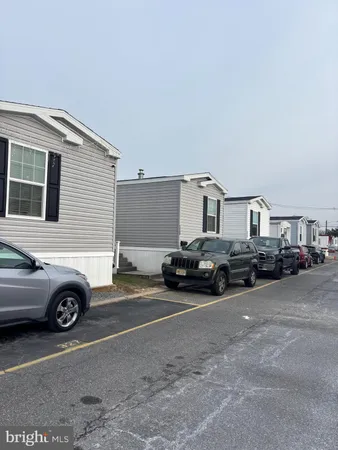 a view of a cars in front of a house