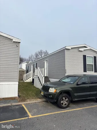 a view of a car parked front of a house