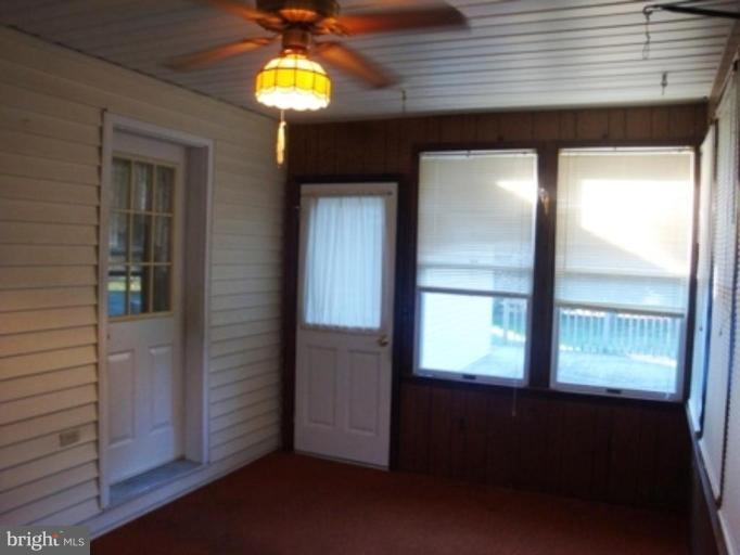 304 Whetstone Road Forest Hill, MD 21050 - Photo 19 of 22 ceiling fan in sunroom which leads to large deck