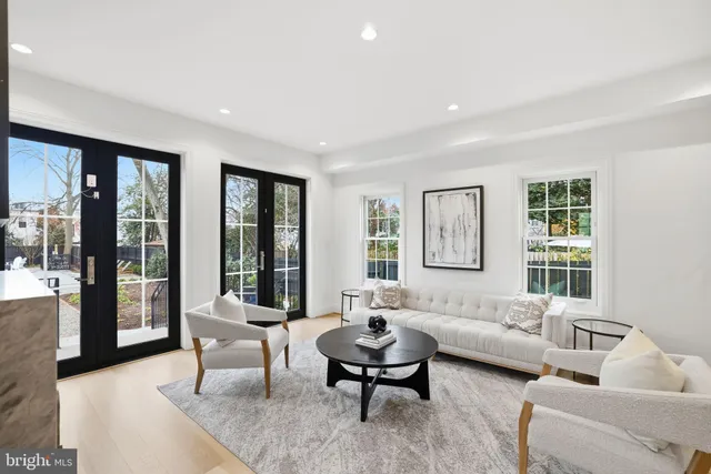 a living room with furniture and windows