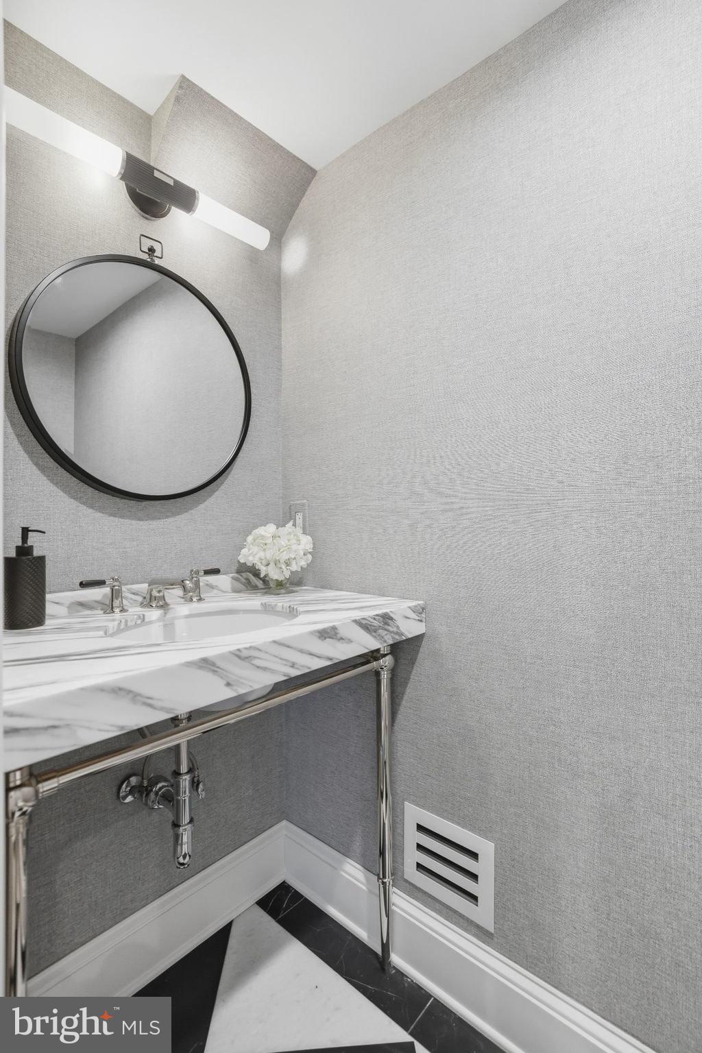 3418 Reservoir Road Northwest Washington, DC 20007 - Photo 14 of 33 a bathroom with a granite countertop sink and a mirror