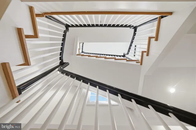 a view of staircase with a rug