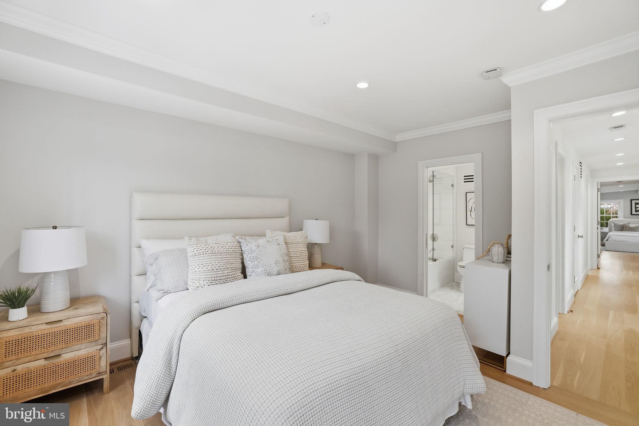 3418 Reservoir Road Northwest Washington, DC 20007 - Photo 21 of 33 a bedroom with a bed and a lamp