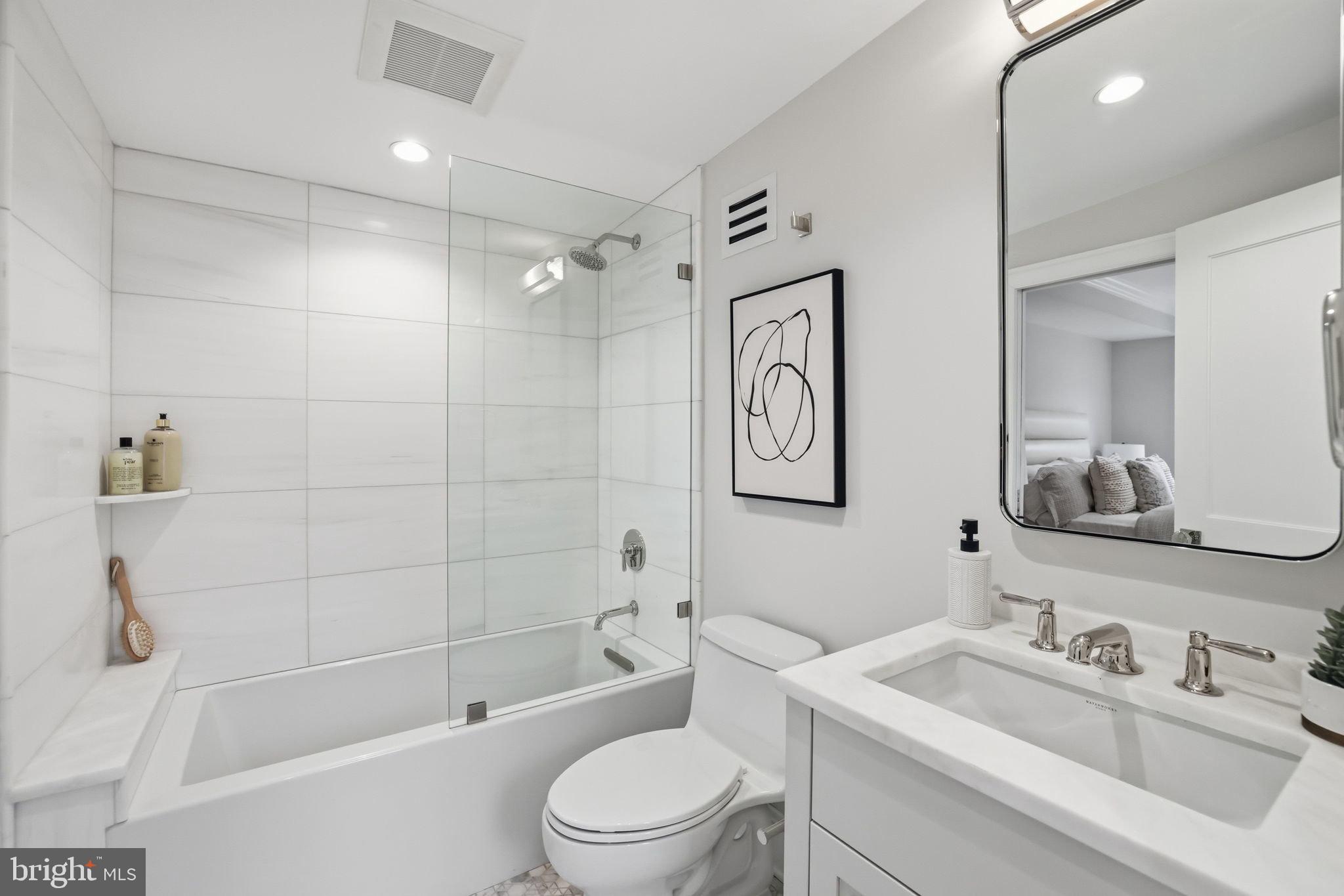 3418 Reservoir Road Northwest Washington, DC 20007 - Photo 22 of 33 a bathroom with a sink toilet and shower