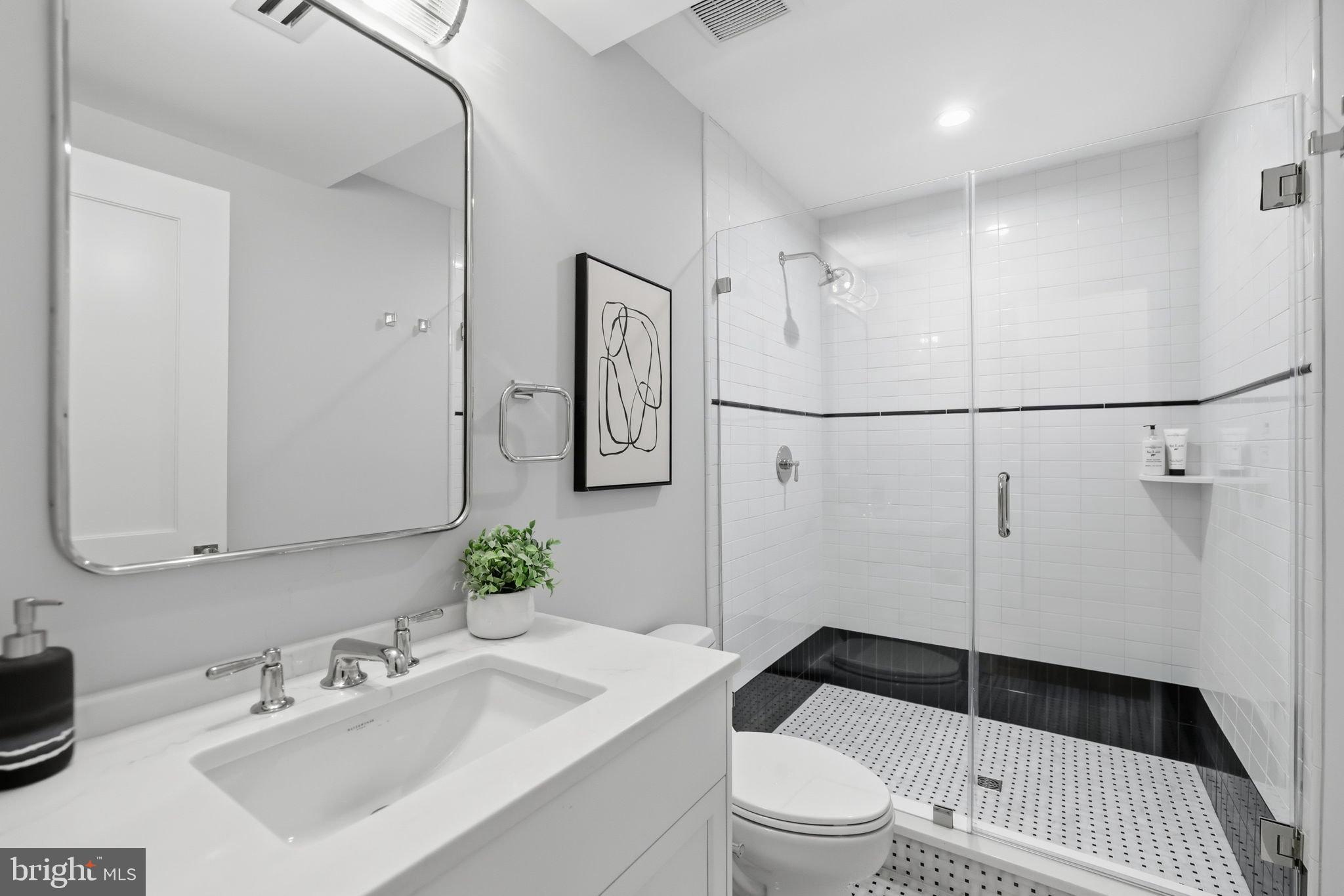 3418 Reservoir Road Northwest Washington, DC 20007 - Photo 29 of 33 a bathroom with a sink toilet and shower