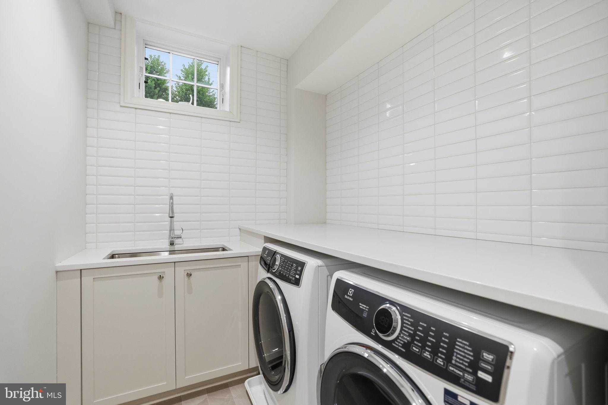 3418 Reservoir Road Northwest Washington, DC 20007 - Photo 30 of 33 a utility room with dryer and washer