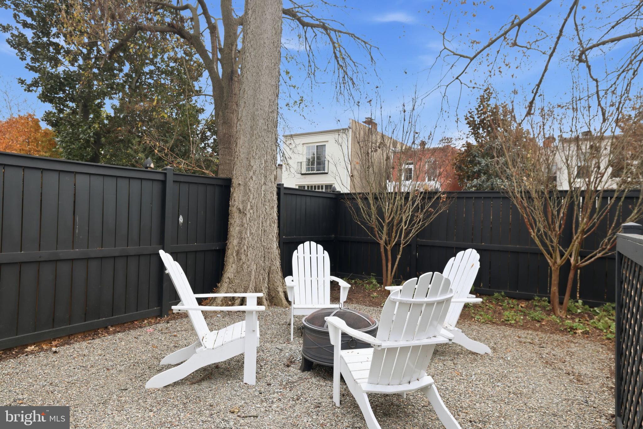 3418 Reservoir Road Northwest Washington, DC 20007 - Photo 33 of 33 a view of backyard with outdoor seating and trees