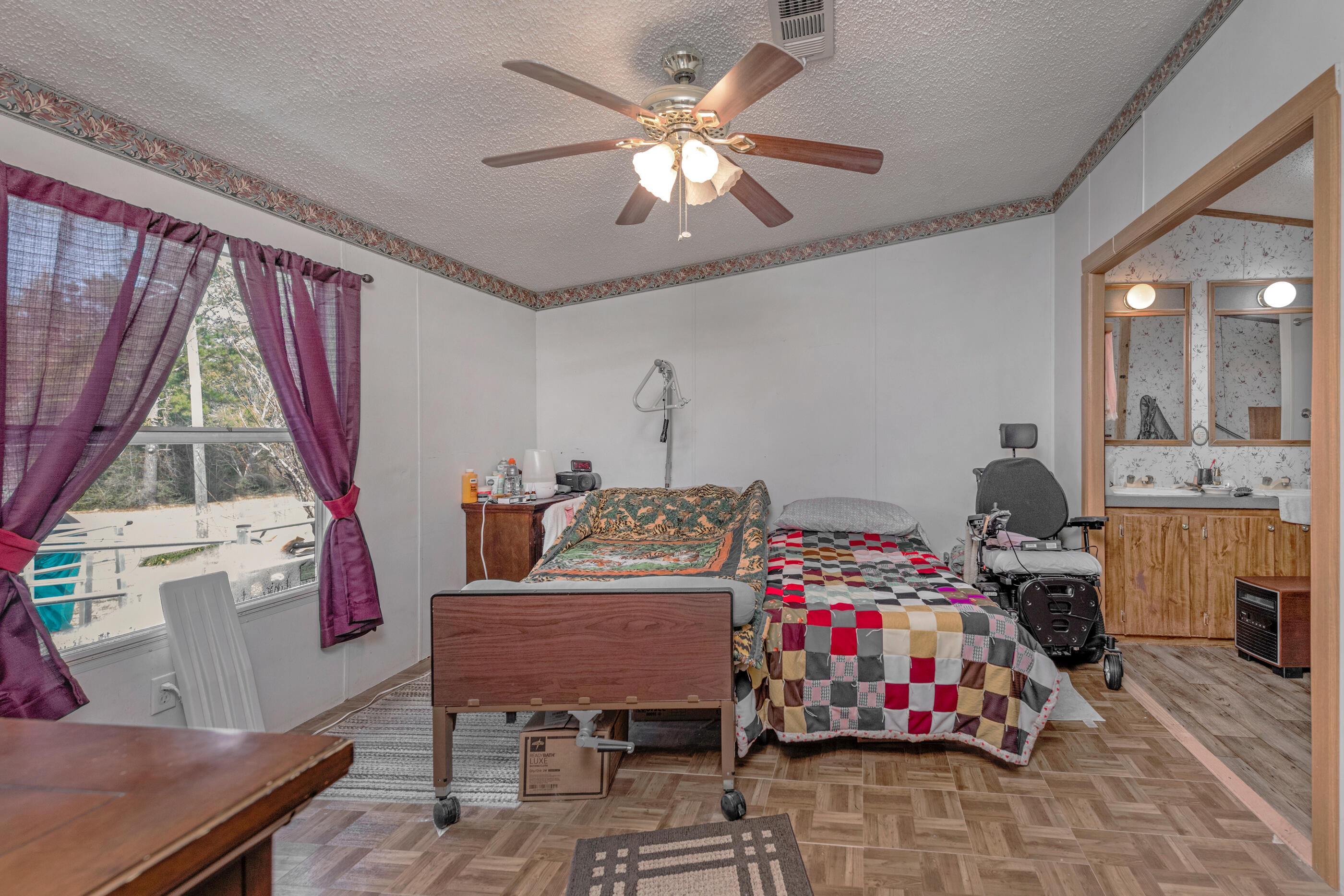 7189 Sherman Kennedy Road Baker, FL 32531 - Photo 16 of 29 a bedroom with bed and a window