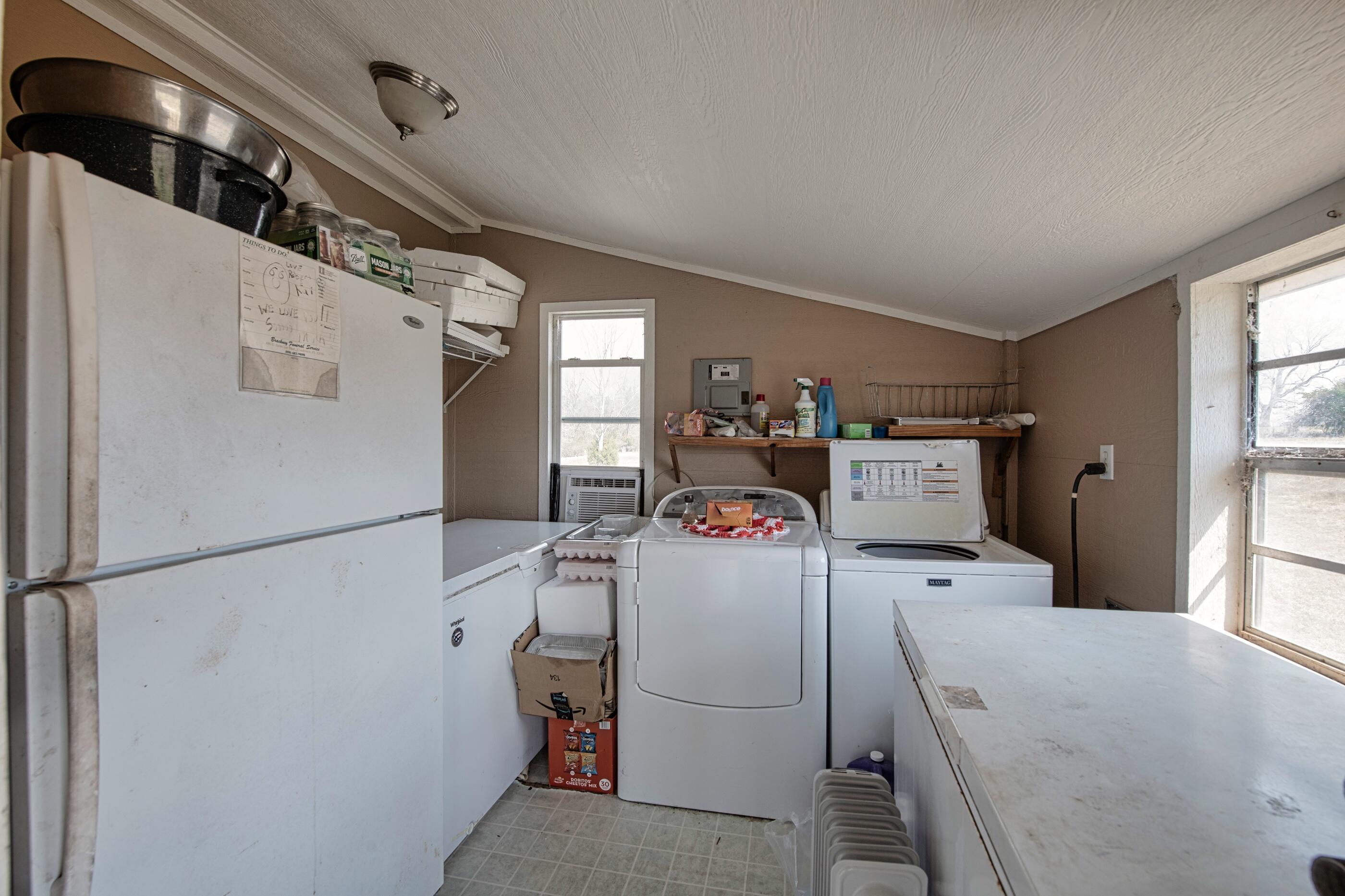 7189 Sherman Kennedy Road Baker, FL 32531 - Photo 17 of 29 a utility room with dryer and washer