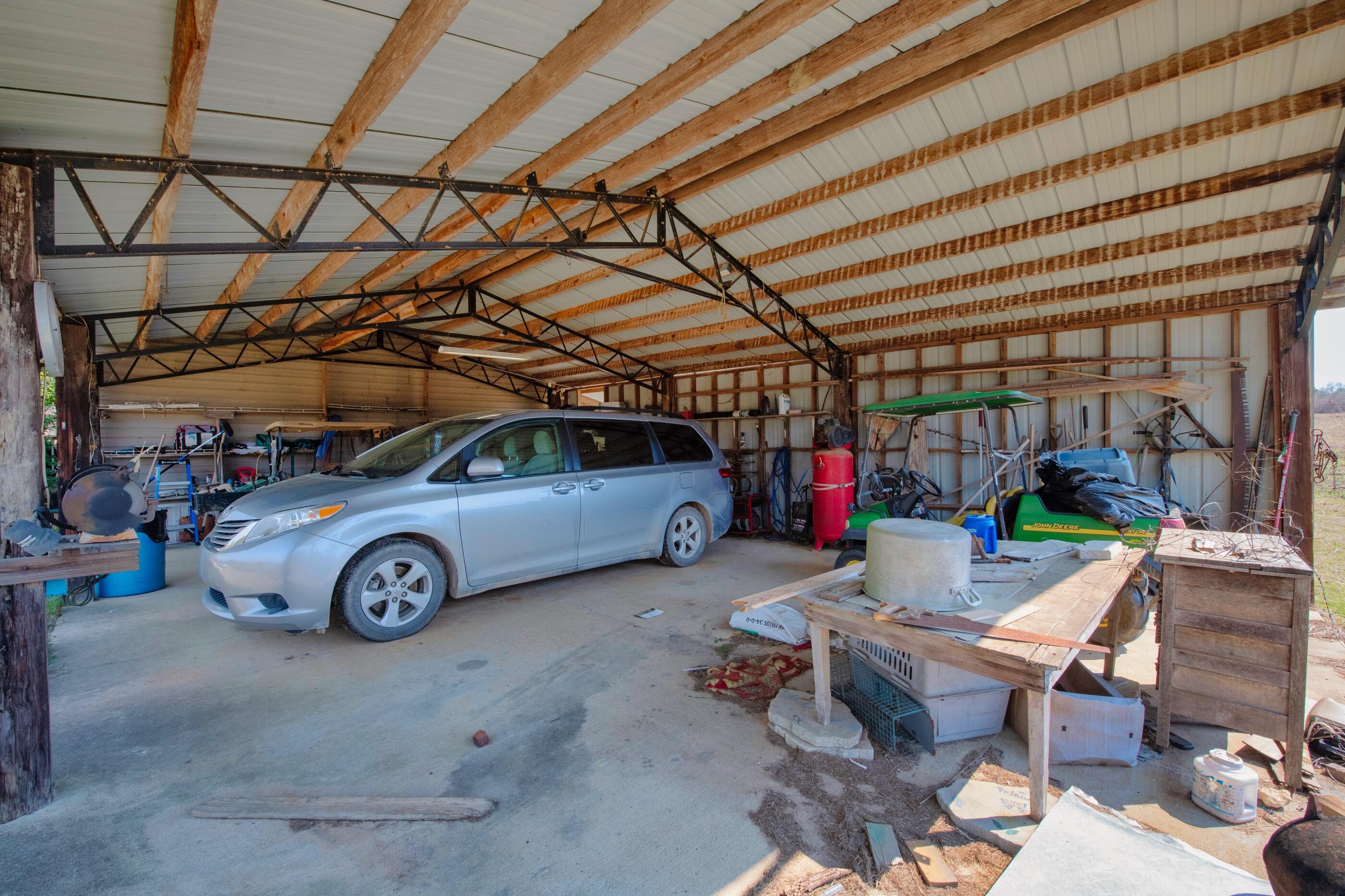 7189 Sherman Kennedy Road Baker, FL 32531 - Photo 19 of 29 a view of car garage