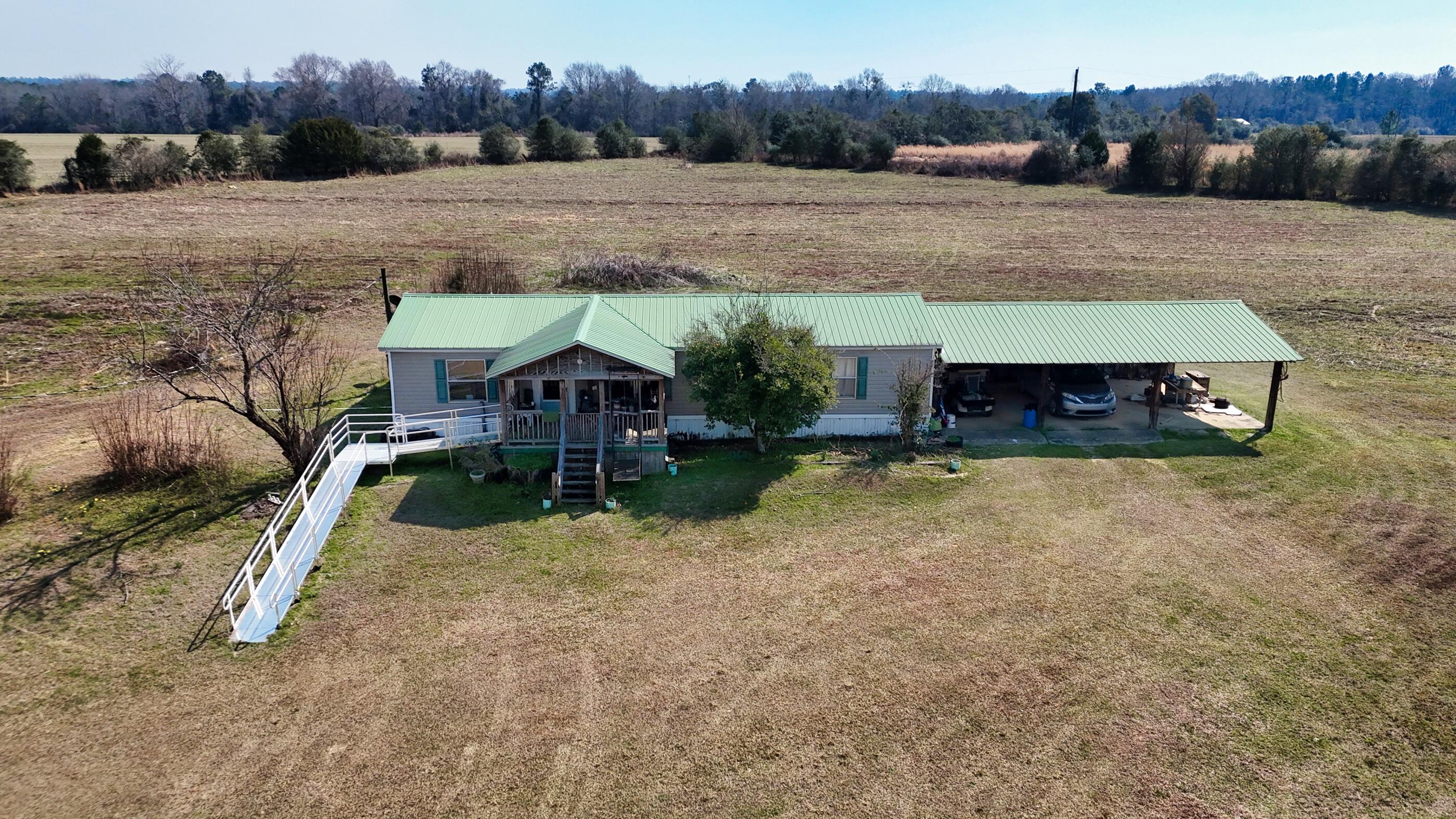 7189 Sherman Kennedy Road Baker, FL 32531 - Photo 6 of 29 an aerial view of a house
