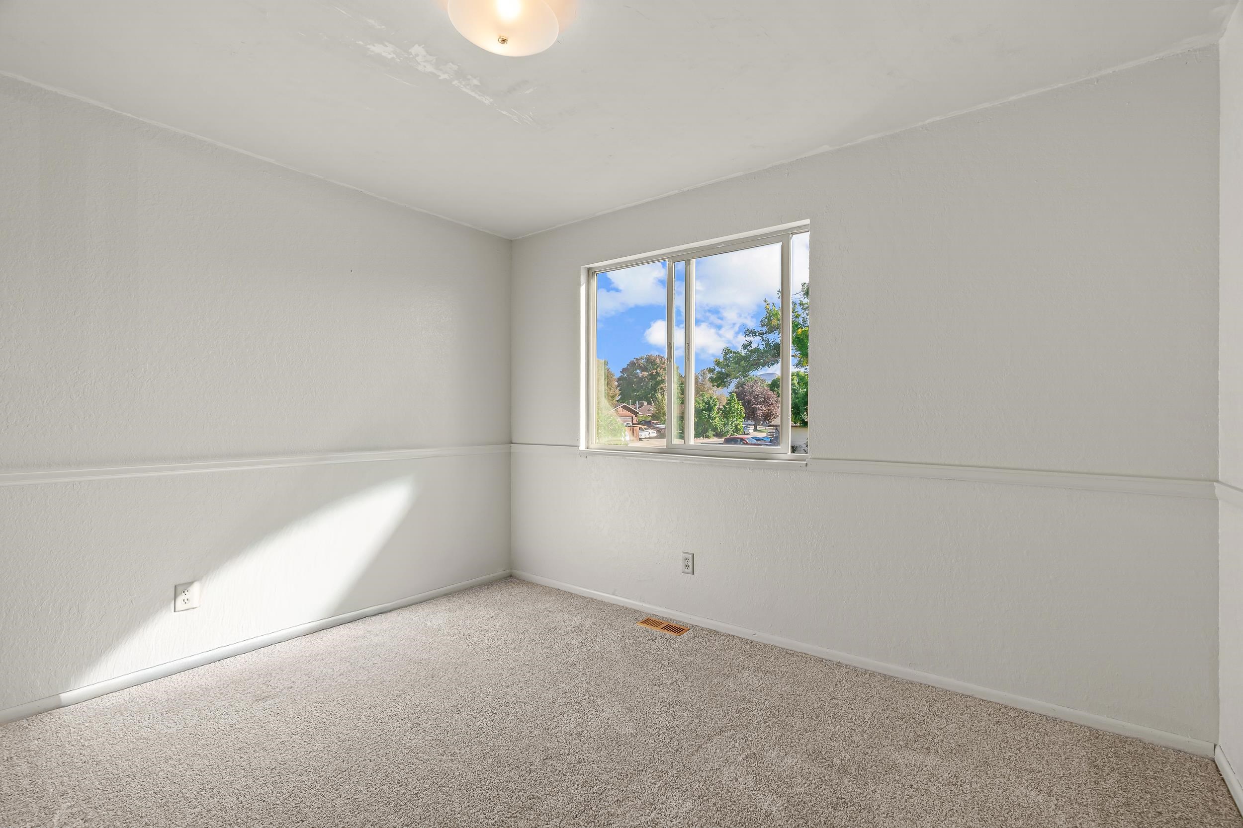 623 Broken Spoke Road Grand Junction, CO 81504 - Photo 16 of 27 a view of an empty room with a window