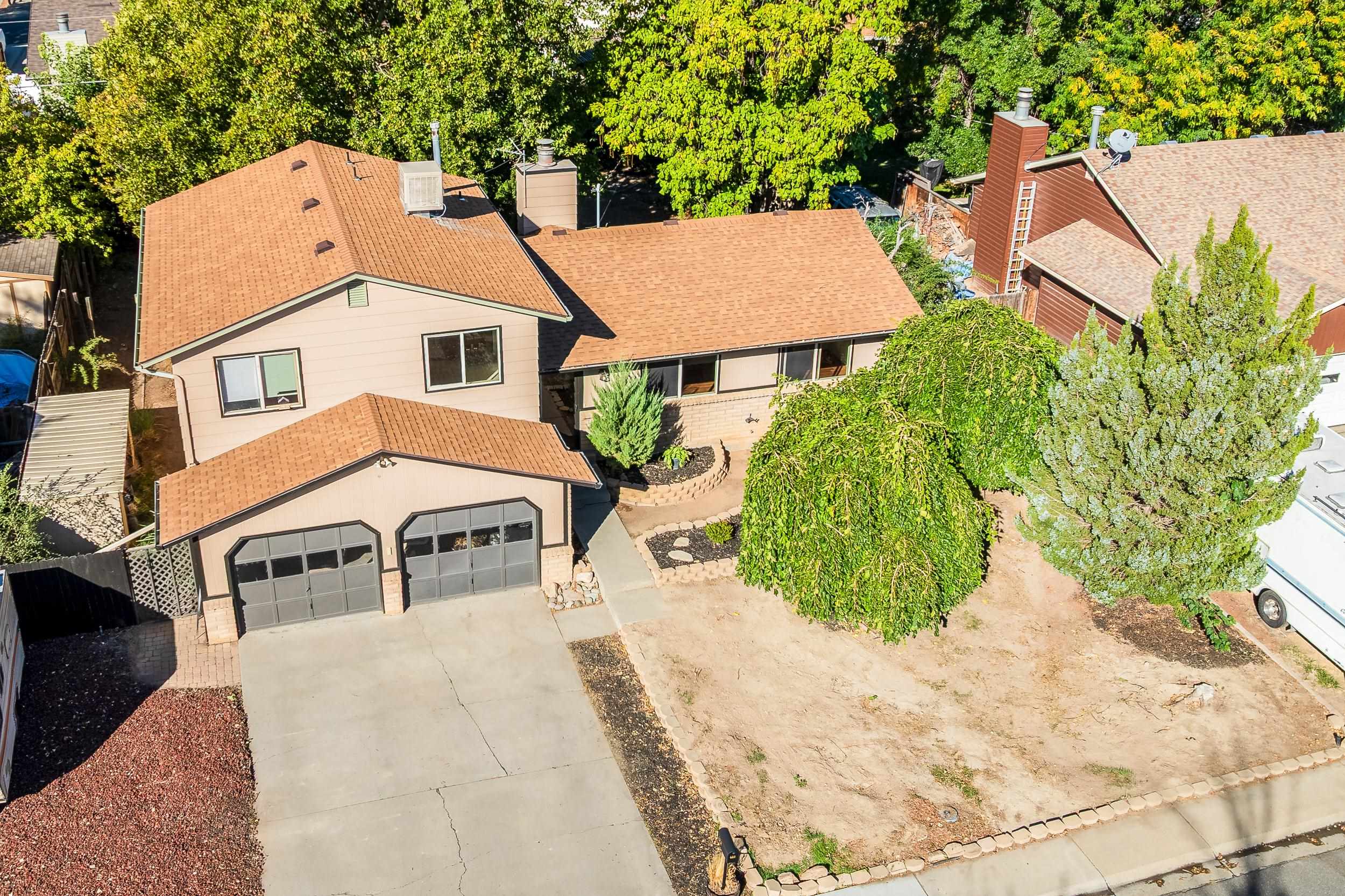 623 Broken Spoke Road Grand Junction, CO 81504 - Photo 2 of 27 an aerial view of a house with a yard