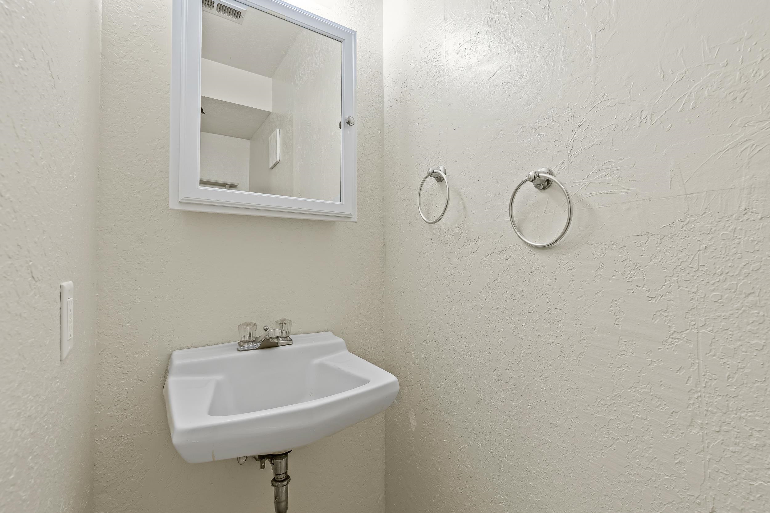 623 Broken Spoke Road Grand Junction, CO 81504 - Photo 22 of 27 a bathroom with a sink a mirror and a shower