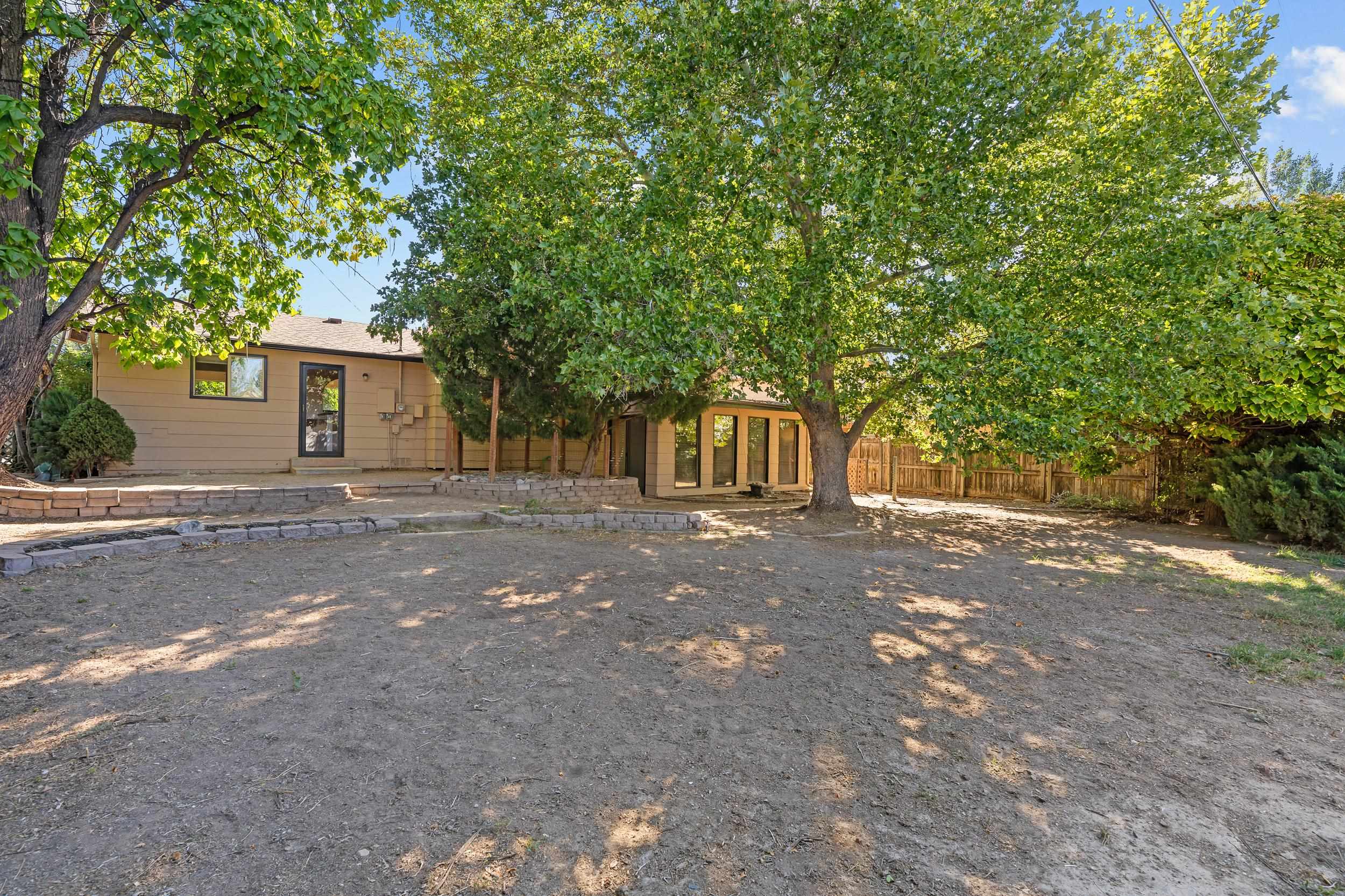 623 Broken Spoke Road Grand Junction, CO 81504 - Photo 26 of 27 a front view of a house with a tree