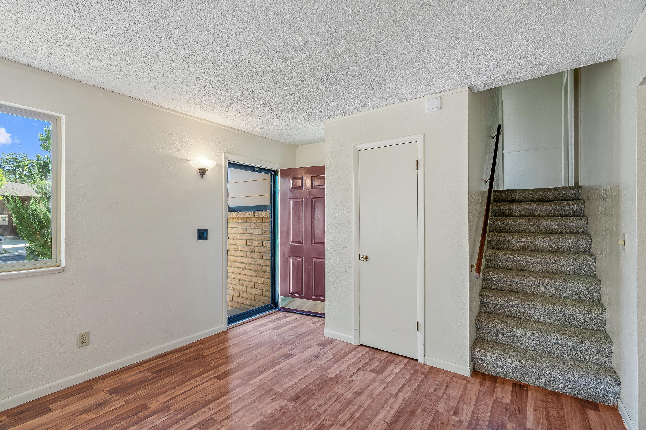 623 Broken Spoke Road Grand Junction, CO 81504 - Photo 5 of 27 a view of empty room with wooden floor and entryway