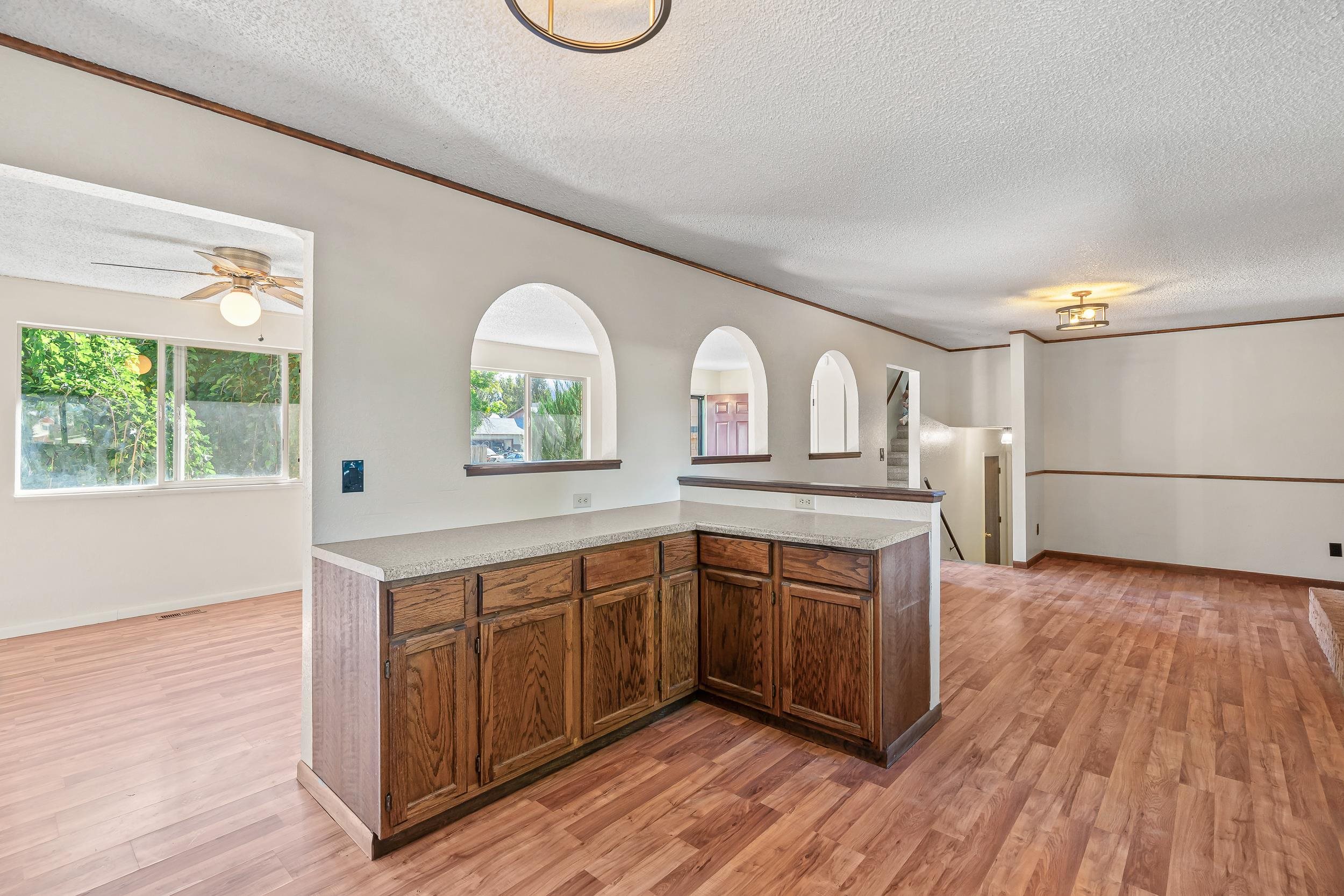 623 Broken Spoke Road Grand Junction, CO 81504 - Photo 8 of 27 a kitchen with stainless steel appliances granite countertop a stove a sink and a refrigerator