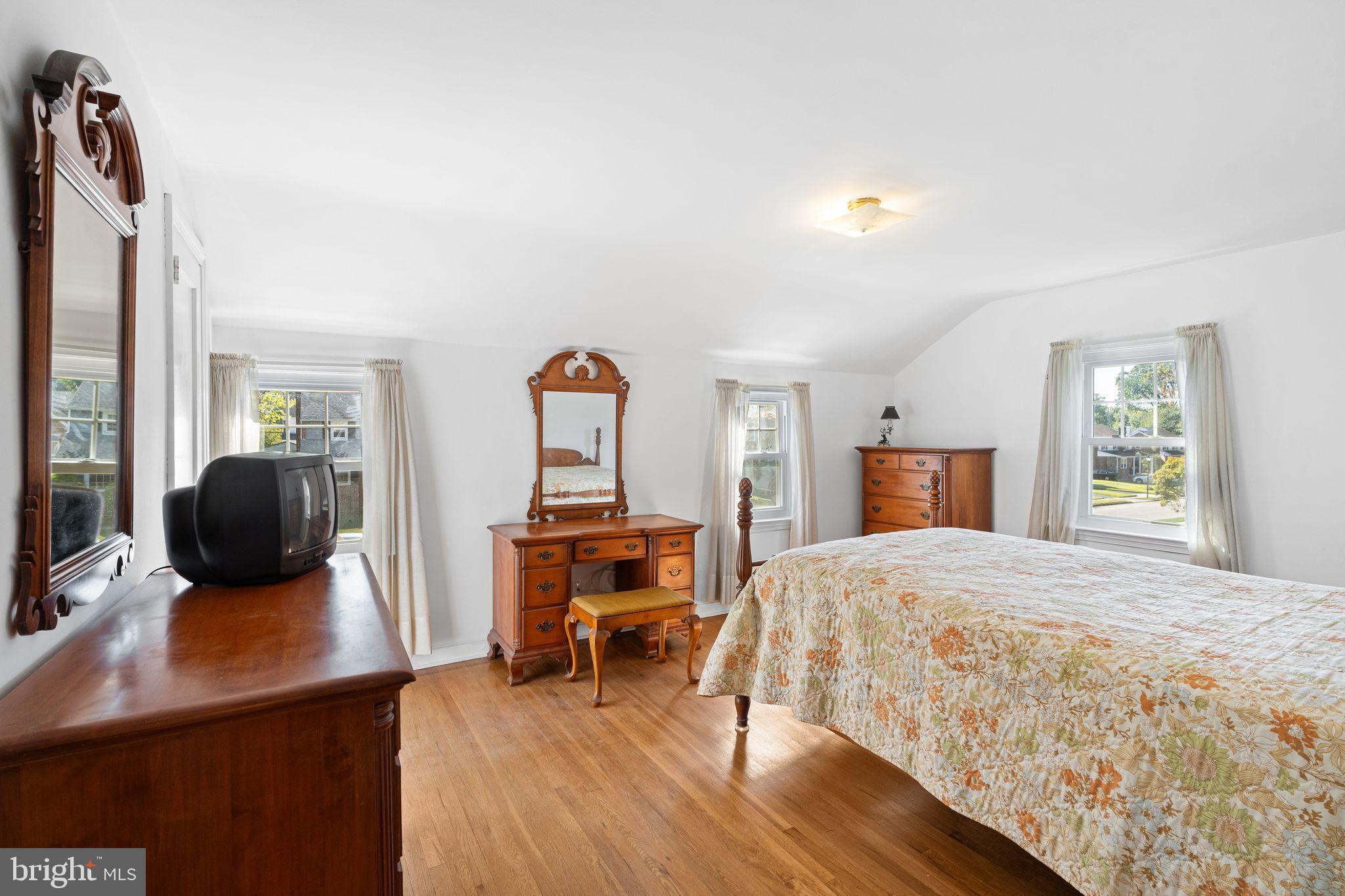 142 Rambling Way Springfield, PA 19064 - Photo 15 of 33 a bedroom with a bed and wooden floor