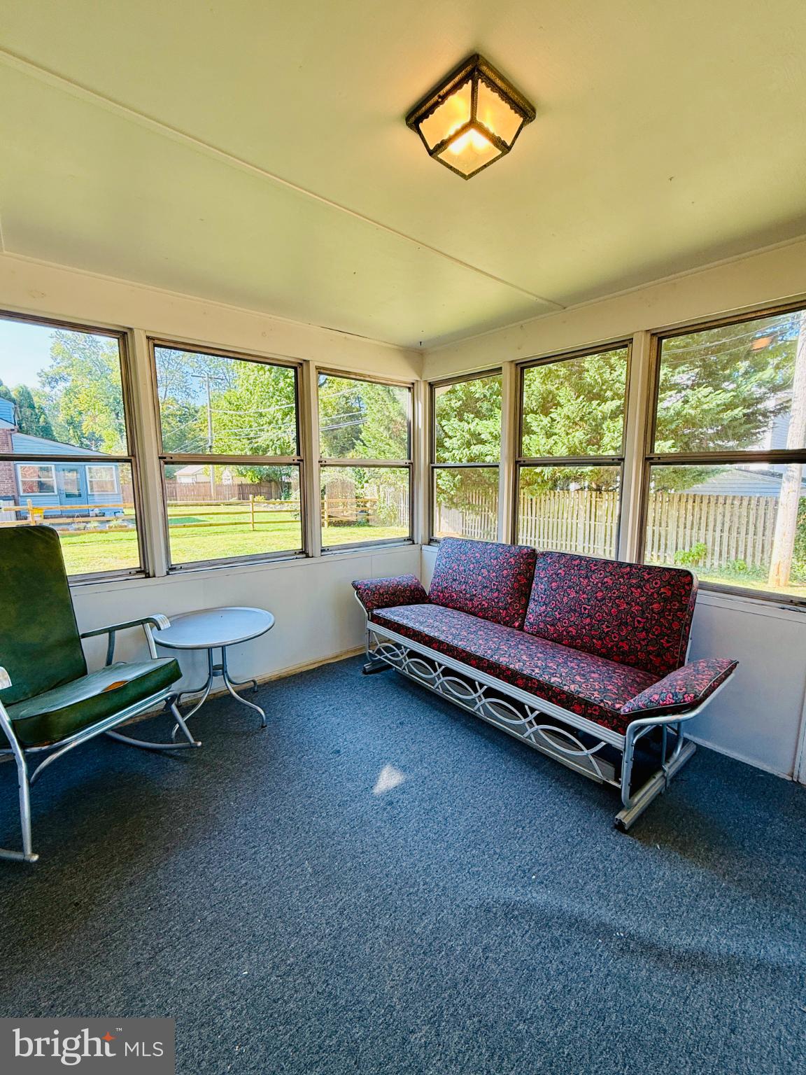 142 Rambling Way Springfield, PA 19064 - Photo 27 of 33 a living room with furniture and a floor to ceiling window