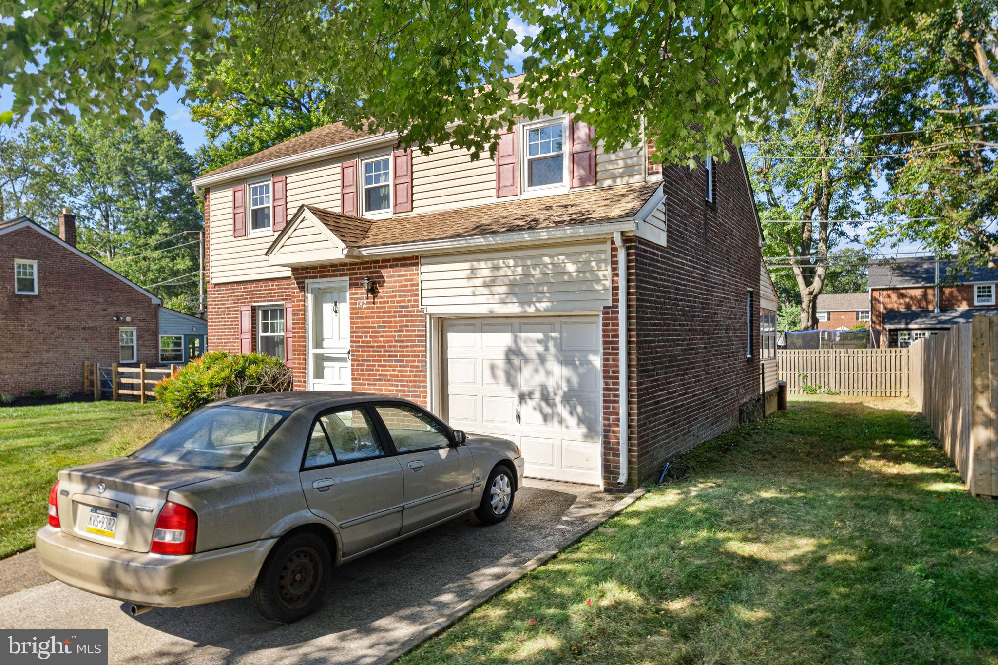 142 Rambling Way Springfield, PA 19064 - Photo 31 of 33 a front view of a house with parking area
