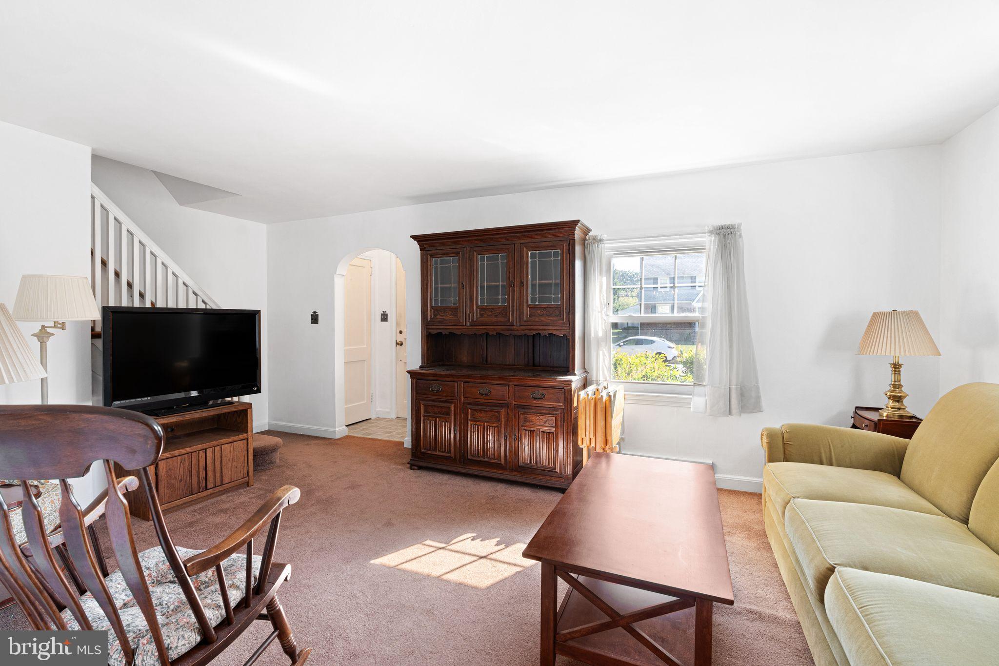 142 Rambling Way Springfield, PA 19064 - Photo 6 of 33 a living room with furniture and a flat screen tv