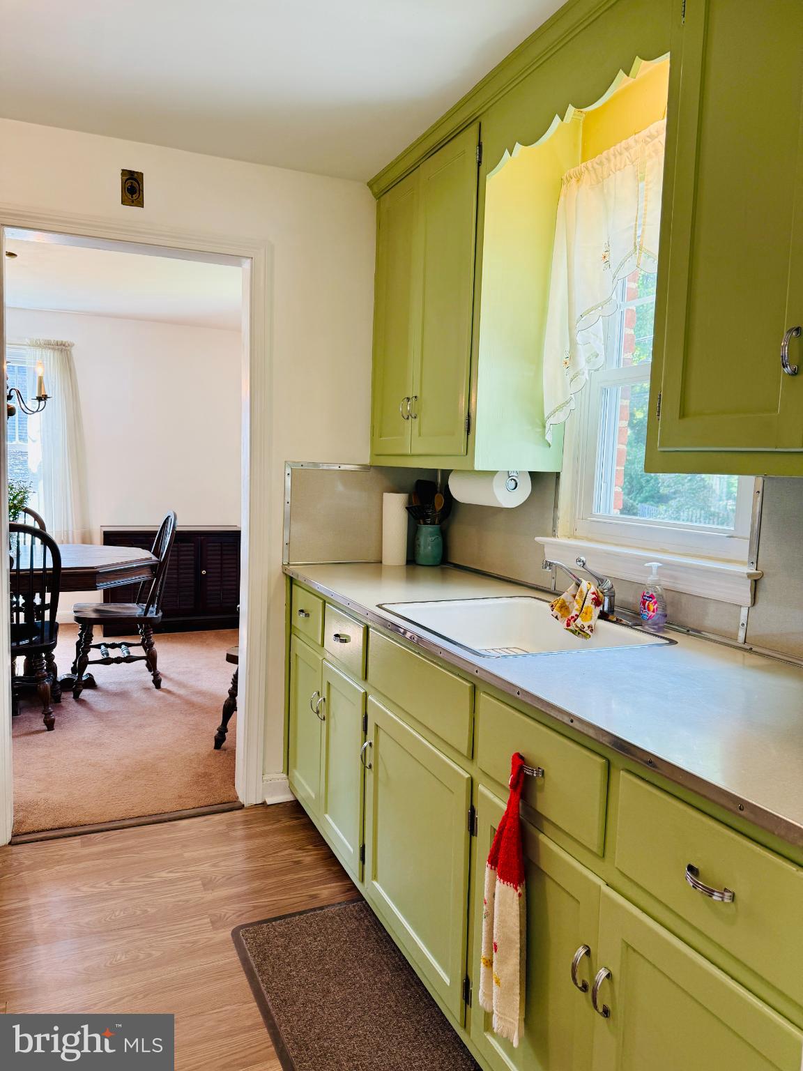 142 Rambling Way Springfield, PA 19064 - Photo 9 of 33 a kitchen with stainless steel appliances cabinets and a large window