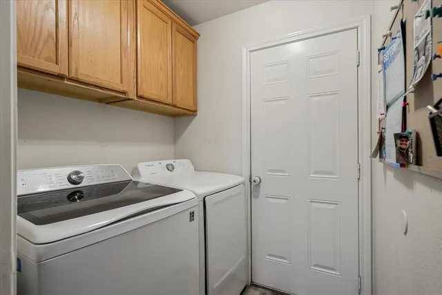 a utility room with dryer and washer