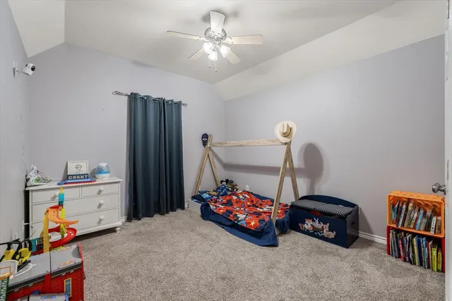 a bedroom with furniture and a chandelier