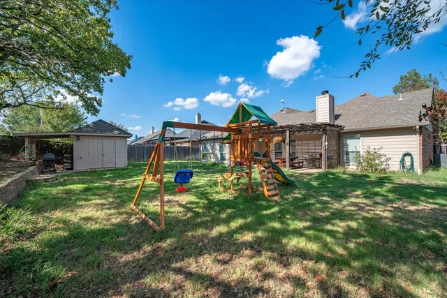 a view of a house with a backyard porch and sitting area