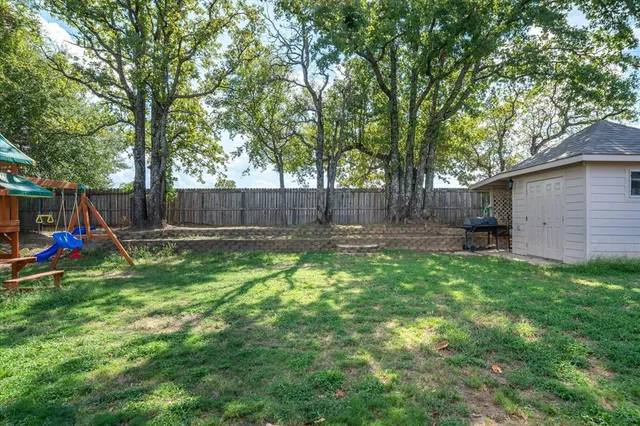 a view of outdoor space with deck and backyard